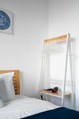 a bedroom with a bed with a ladder next to a window at MUJI B&W Studio - Seaview at 218 Tropicana NEAR Komtar Food Heaven with Netflix & TV Box in George Town