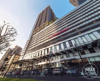 a tall building with cars parked in front of it at MUJI B&W Studio - Seaview at 218 Tropicana NEAR Komtar Food Heaven with Netflix & TV Box in George Town