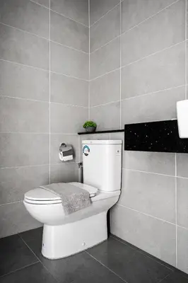 a bathroom with a toilet with a towel on it at MUJI Studio 2 - Seaview at 218 Tropicana Near Komtar Food Heaven with Netflix & TV Box in George Town