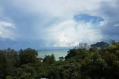 a view of the ocean and a city at NEW SEAVIEW Cozy Modern Beach House in Tanjung Bungah