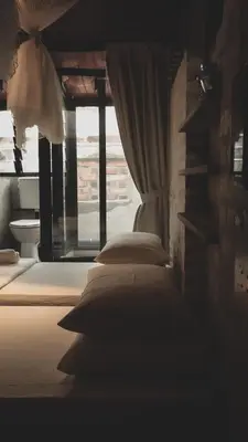 a bedroom with two beds and a window at Frenz Republic - SELF CHECK IN in George Town