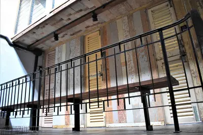a stair railing on the side of a building at Frenz Republic - SELF CHECK IN in George Town