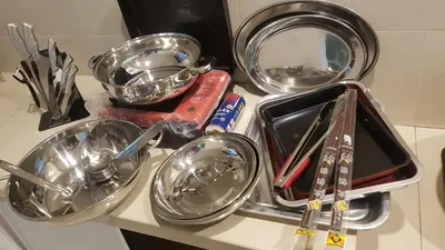 a counter top with bowls and utensils on it at Rose Hill Gardens in Brinchang