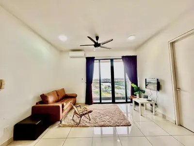 a living room with a couch and a ceiling fan at Entire Condominium @ Woodsburry Butterworth Penang in Butterworth