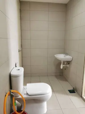 a bathroom with a toilet and a sink at Entire Condominium @ Woodsburry Butterworth Penang in Butterworth