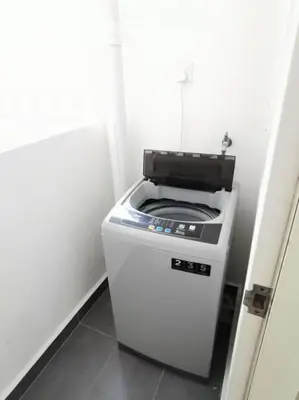 a small stove in a corner of a room at Entire Condominium @ Woodsburry Butterworth Penang in Butterworth