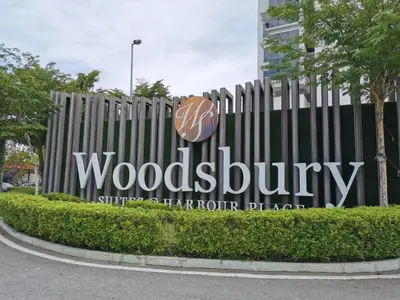 a woodenbury sign in front of a fence at Entire Condominium @ Woodsburry Butterworth Penang in Butterworth