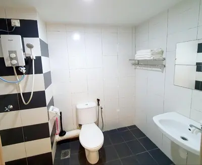 a bathroom with a toilet and a sink at Explore The World at The CEO Studio Penang in Bayan Lepas
