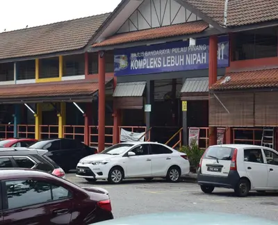 a group of cars parked in front of a building at Explore The World at The CEO Studio Penang in Bayan Lepas