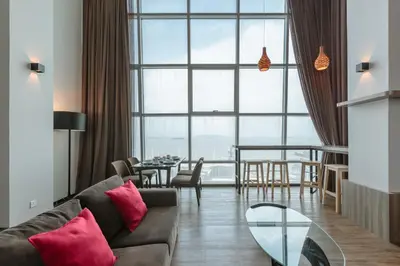 a living room with a couch and a glass table at Maritime in George Town