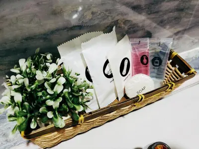 a basket with white flowers in it on a table at Winggarden Murals House by JE Boutique Guesthouse in Ipoh