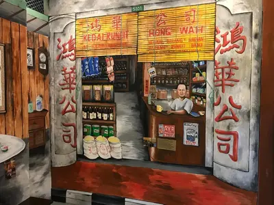a painting of a bar with a man at a counter at Winggarden Murals House by JE Boutique Guesthouse in Ipoh