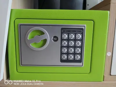 a green object with a calculator on top at Mcz homestay ipoh town 2room 7pax free wifi in Ipoh