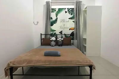 a small bedroom with a bed with a window at be.Animania -8-10mins Lost World Tambun -14-18pax in Ipoh