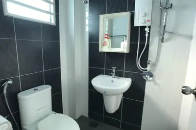 a bathroom with a toilet and a sink at be.Animania -8-10mins Lost World Tambun -14-18pax in Ipoh
