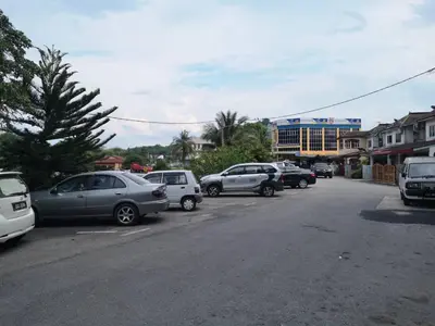 a group of cars parked on the side of a street at NICE STAY HOTEL in Raub