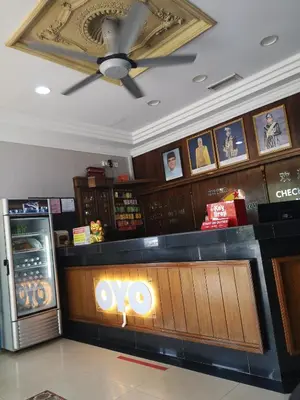 a restaurant with aoops sign on the counter in a restaurant at NICE STAY HOTEL in Raub