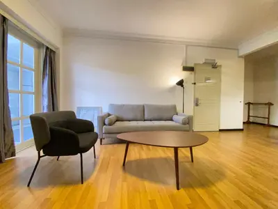 a living room with a couch and a table at Parkland Suites in Brinchang