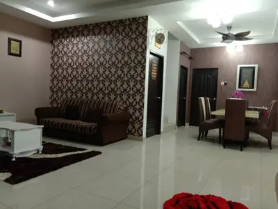 a living room with a couch and a table at TRIPLE A Homestay in Ipoh