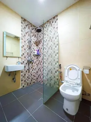 a bathroom with a toilet and a shower and a sink at Gather Here 62 5BR Town Center 5 Rooms in Taiping