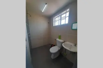 a bathroom with a toilet and a sink at HM Homestay Lahat, Station 18, Ipoh 'مسلم' in Lahat