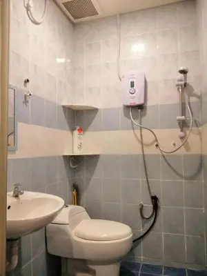 a bathroom with a toilet and a sink at Green Hill Resort Tanah Rata 3R2B WiFi in Tanah Rata