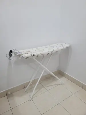 a white table sitting on top of a floor at Ipoh Meru Modern Cozy Home NAZ IPOH HOMESTAY in Ipoh
