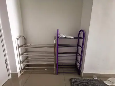 a room with two metal racks in a room at The Venus Sitiawan Breezee Spacious Homestay 6 to 8 Pax in Kampong Lumut Kiri