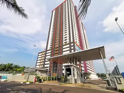 a tall building with a gas station in front of it at The Venus Sitiawan Breezee Spacious Homestay 6 to 8 Pax in Kampong Lumut Kiri