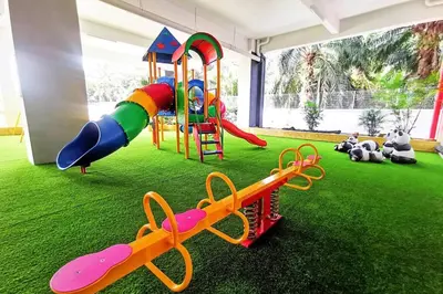 a play room with a playground with a slide at The Venus Sitiawan Spacious High Floor Homestay 6 to 10 Pax in Kampong Lumut Kiri