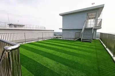 a balcony with green grass on a building at The Venus Sitiawan Spacious High Floor Homestay 6 to 10 Pax in Kampong Lumut Kiri