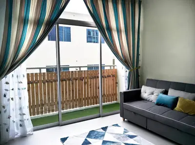 a living room with a couch and a large window at MiahPuteh Cozy Homestay Cameron Highlands Pasar Malam in Brinchang
