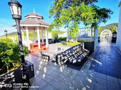 a gazebo with a bench and a street light at MiahPuteh Cozy Homestay Cameron Highlands Pasar Malam in Brinchang