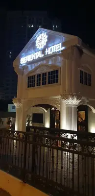 a hotel building with a sign on it at night at Seriental Hotel I check in 3pm-11pm only in Tanjong Tokong