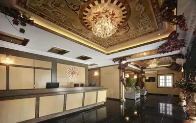 a lobby of a hotel with a chandelier at Seriental Hotel I check in 3pm-11pm only in Tanjong Tokong