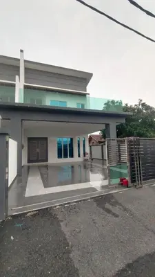 a house with a gate in front of it at Villa Chee in Sekincan