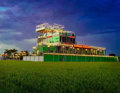 a large building with lights on top of it at Villa Chee in Sekincan