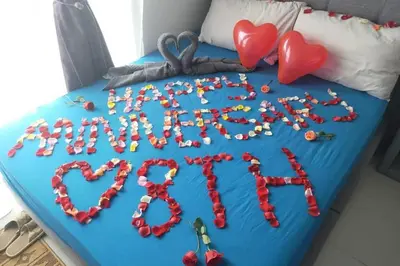 a blue bed with a heart spelled out with beads at LOVE LODGE BRINCHANG, CAMERON HIGHLANDS in Tanah Rata