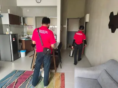 two men in red shirts standing in a kitchen at LOVE LODGE BRINCHANG, CAMERON HIGHLANDS in Tanah Rata
