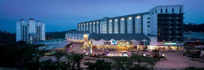 a large building with a courtyard in front of it at Hills Aranda Nova Hotel in Cameron Highlands