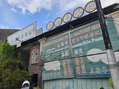 a building with clocks on the side of it at Room at Lebuh Armenian Georgetown City Center in George Town