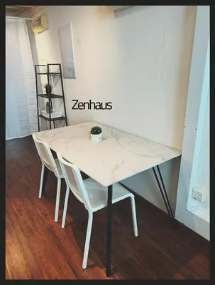 a table with two chairs and a white marble top at The ceo suites by Zenbnb in Bayan Lepas