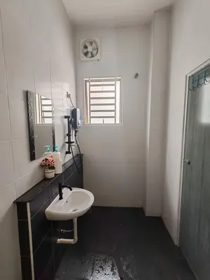 a white bathroom with a sink and a mirror at Teluk Batik 17ParadiseHome Private Pool Karaoke Snooker BBQ 15pax in Lumut