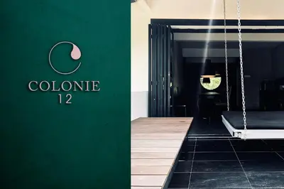 a green wall with a sign that reads colorne at 80 Colonie Fraser's Hill 8pax in Bukit Fraser
