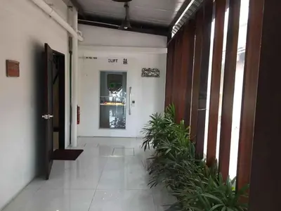 an empty hallway with plants in a building at 7 Hotel in Juru