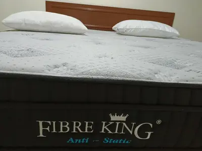 a bed with two pillows on top of it at Pangkor Coral Bay Resort(2 bedrooms) in Pangkor