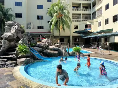 a group of children playing in the pool at a resort at Pangkor Coral Bay Resort(2 bedrooms) in Pangkor