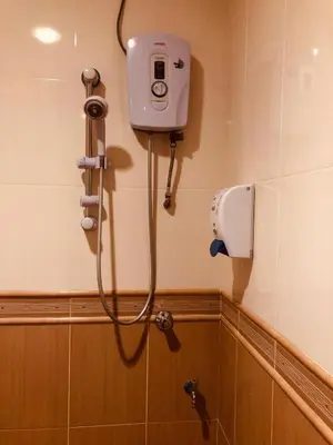 a shower in a bathroom with a camera on the wall at Hotel Chua Gin @ Brinchang Centre in Brinchang