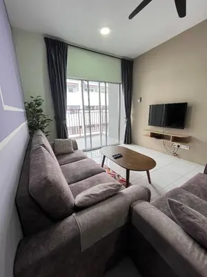 a living room with two couches and a television at Cameron Emerald Avenue @ Brinchang in Cameron Highlands
