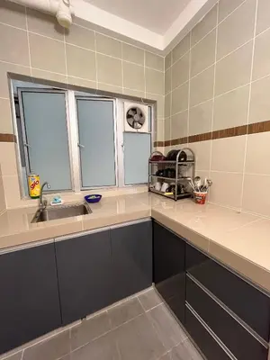 a kitchen with a sink and two windows at Cameron Emerald Avenue @ Brinchang in Cameron Highlands